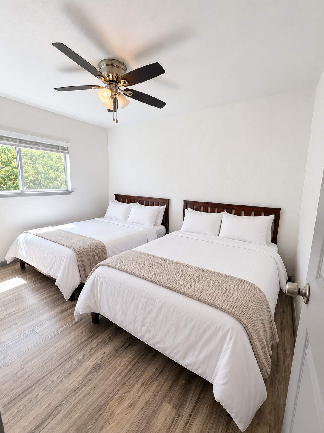 Furnished shared bedroom at Montgomery House, shown in an enhanced marketing image